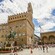 Visitors viewing the statue of David and other historic landmarks in the medieval Piazza della Signoria